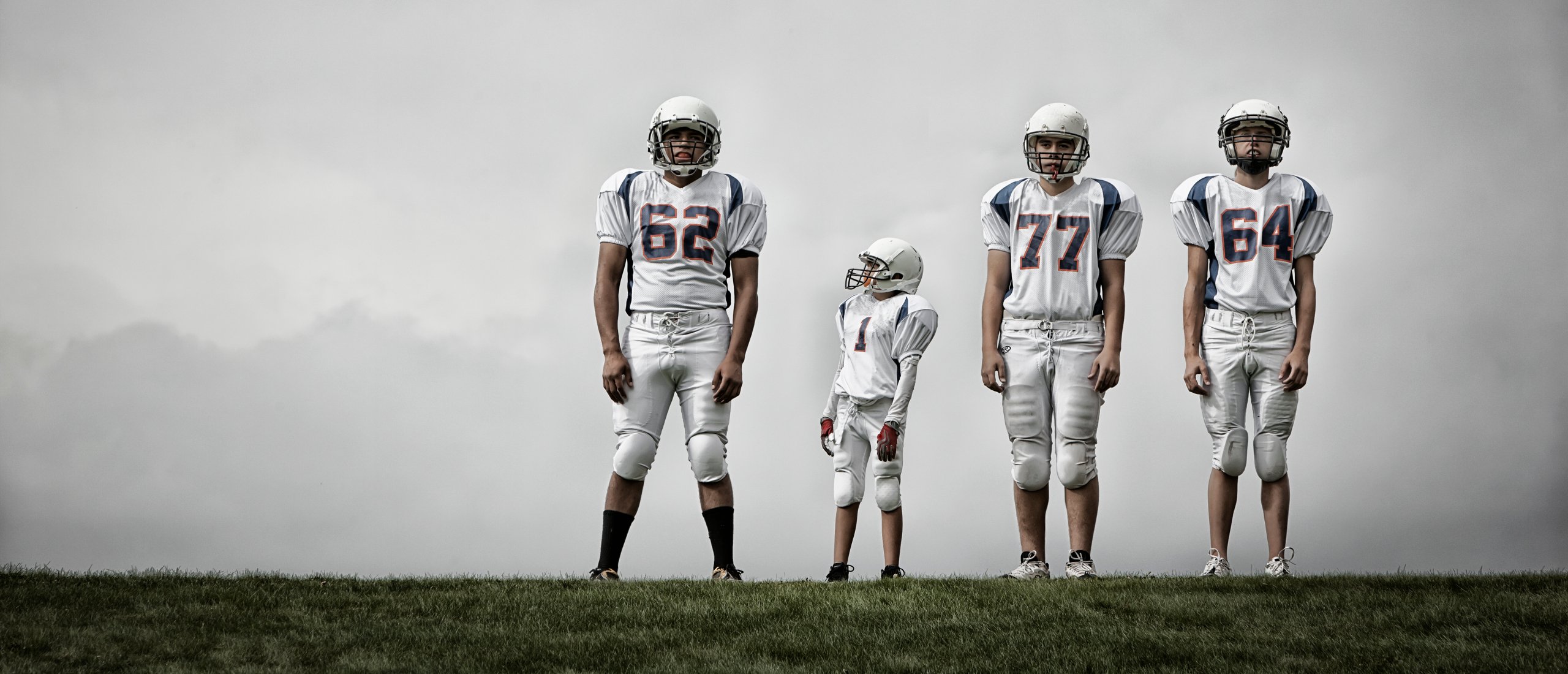 a-group-of-four-football-players-in-sports-uniform-2022-03-04-02-27-32-utc-2560x1100